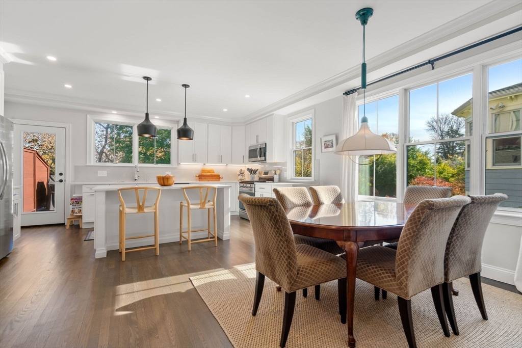 35 Algonquin Road, Unit 35 Chestnut Hill, MA 02467 - Photo 1 of 38 a dining room with furniture a chandelier and wooden floor