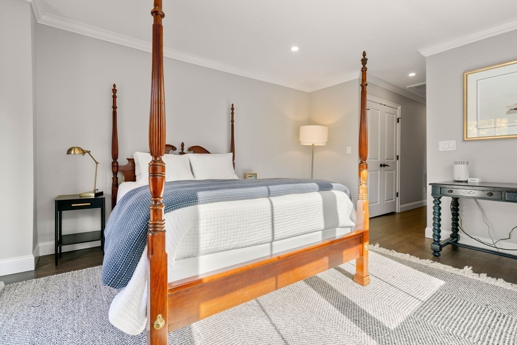 35 Algonquin Road, Unit 35 Chestnut Hill, MA 02467 - Photo 18 of 38 a spacious bedroom with a large window and a table chair