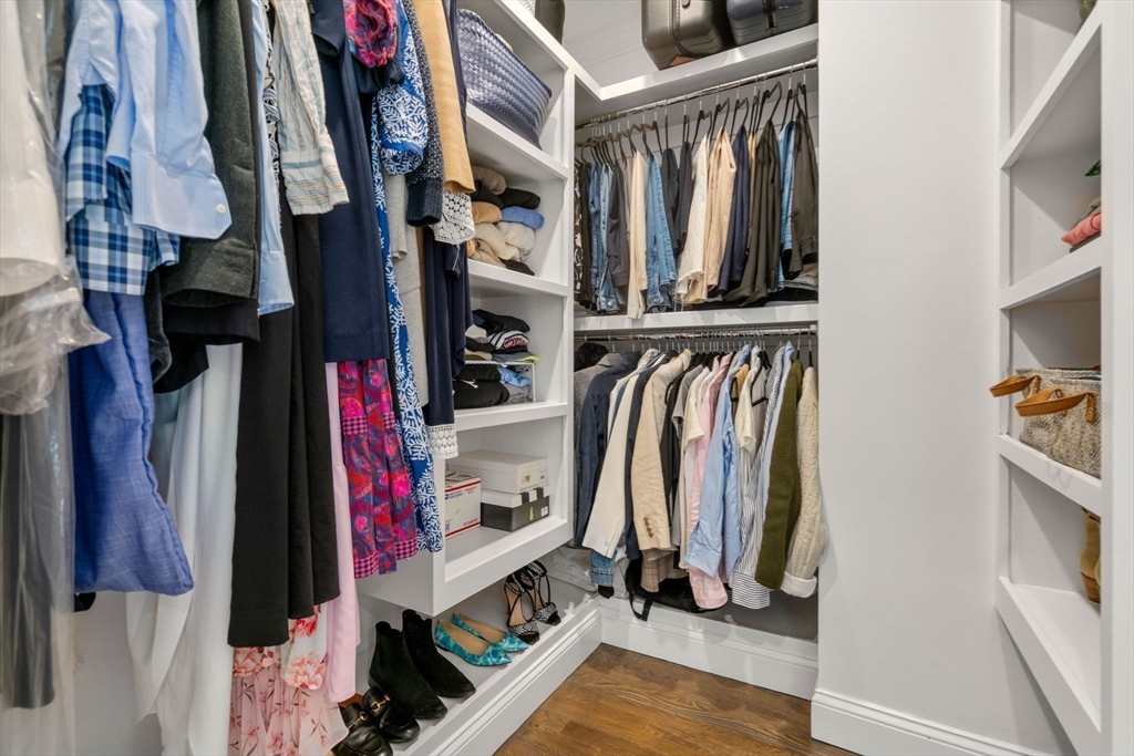 35 Algonquin Road, Unit 35 Chestnut Hill, MA 02467 - Photo 19 of 38 a view of walk in closet with clothes and shoes