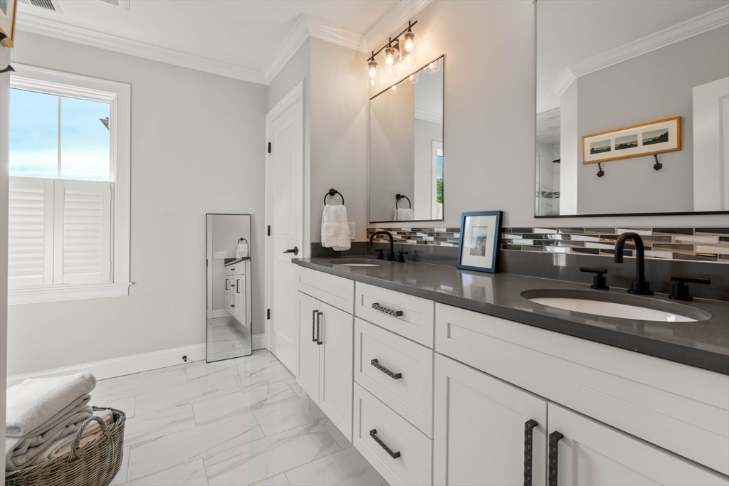 35 Algonquin Road, Unit 35 Chestnut Hill, MA 02467 - Photo 21 of 38 a spacious bathroom with double vanity and a mirror