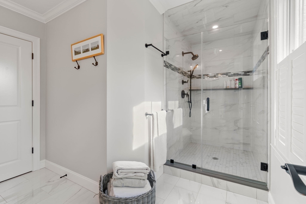35 Algonquin Road, Unit 35 Chestnut Hill, MA 02467 - Photo 22 of 38 a bathroom with a shower