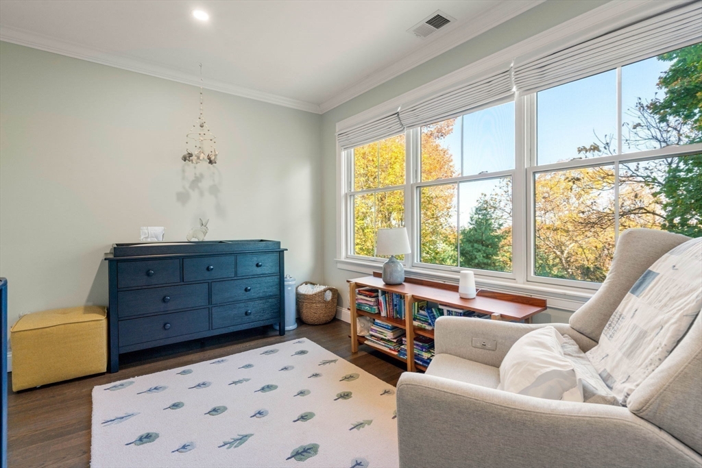 35 Algonquin Road, Unit 35 Chestnut Hill, MA 02467 - Photo 24 of 38 a living room with furniture and a large window