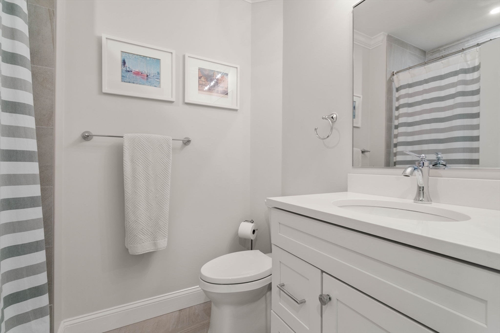 35 Algonquin Road, Unit 35 Chestnut Hill, MA 02467 - Photo 26 of 38 a bathroom with a sink toilet and shower