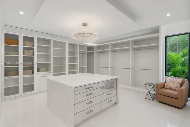 a lobby with furniture and a mirror