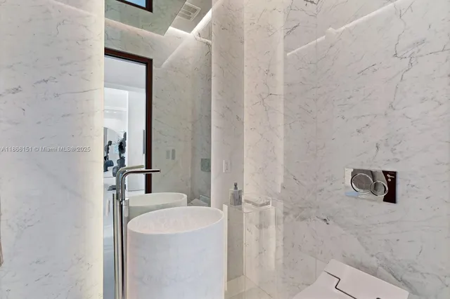 a bedroom with a large bed and a large window