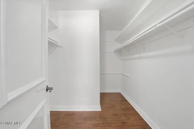 a view of an empty walk in closet