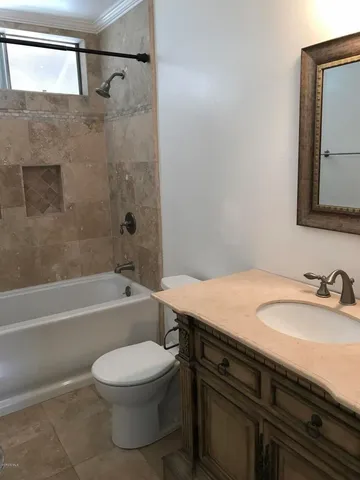 a bathroom with a sink a toilet and a bathtub