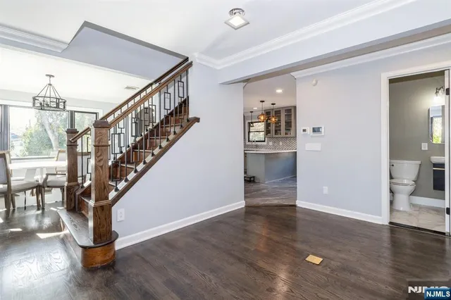 a kitchen with granite countertop cabinets stainless steel appliances and a sink