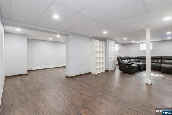 a area with furniture and wooden floor