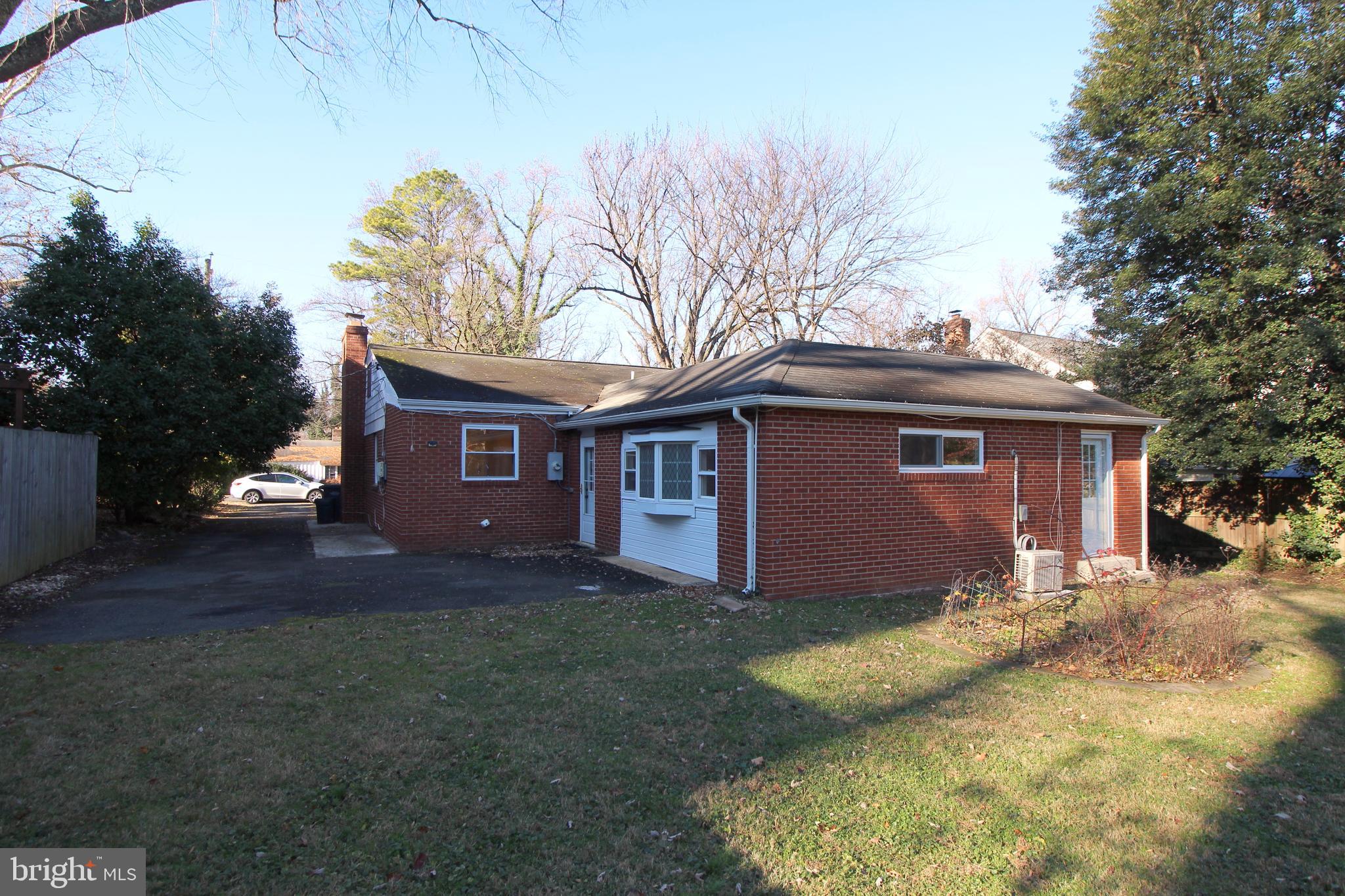 2129 Grayson Place Falls Church, VA 22043 - Photo 15 of 26 a view of a yard in front of a house with large trees