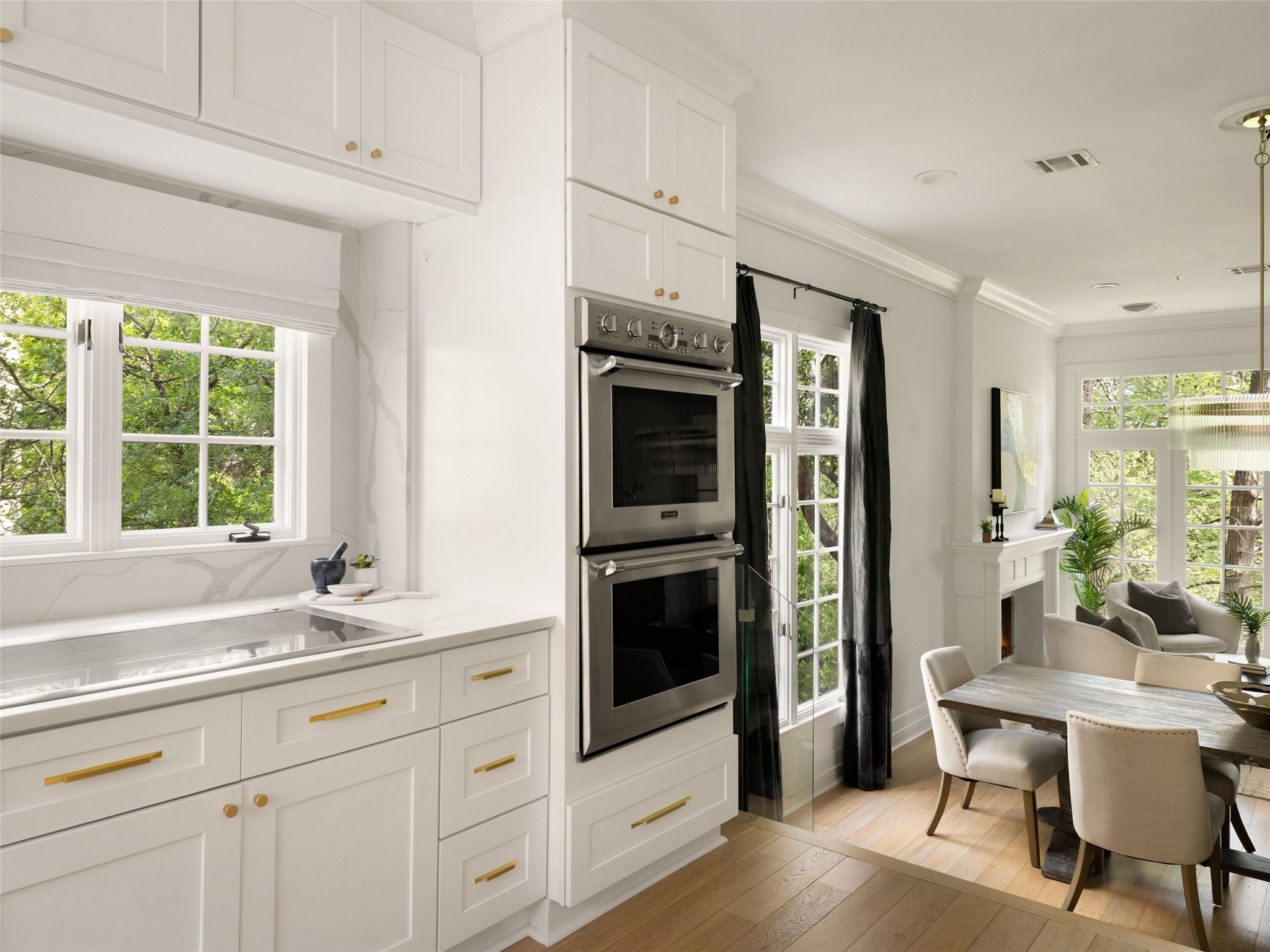 1937 Rue De St Tropez, Unit 10 Austin, TX 78746 - Photo 12 of 39 a kitchen with stainless steel appliances white cabinets and a window