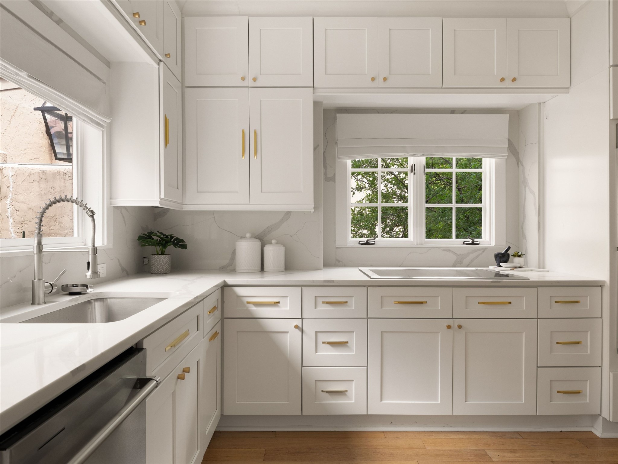 1937 Rue De St Tropez, Unit 10 Austin, TX 78746 - Photo 13 of 39 a kitchen with white cabinets and sink
