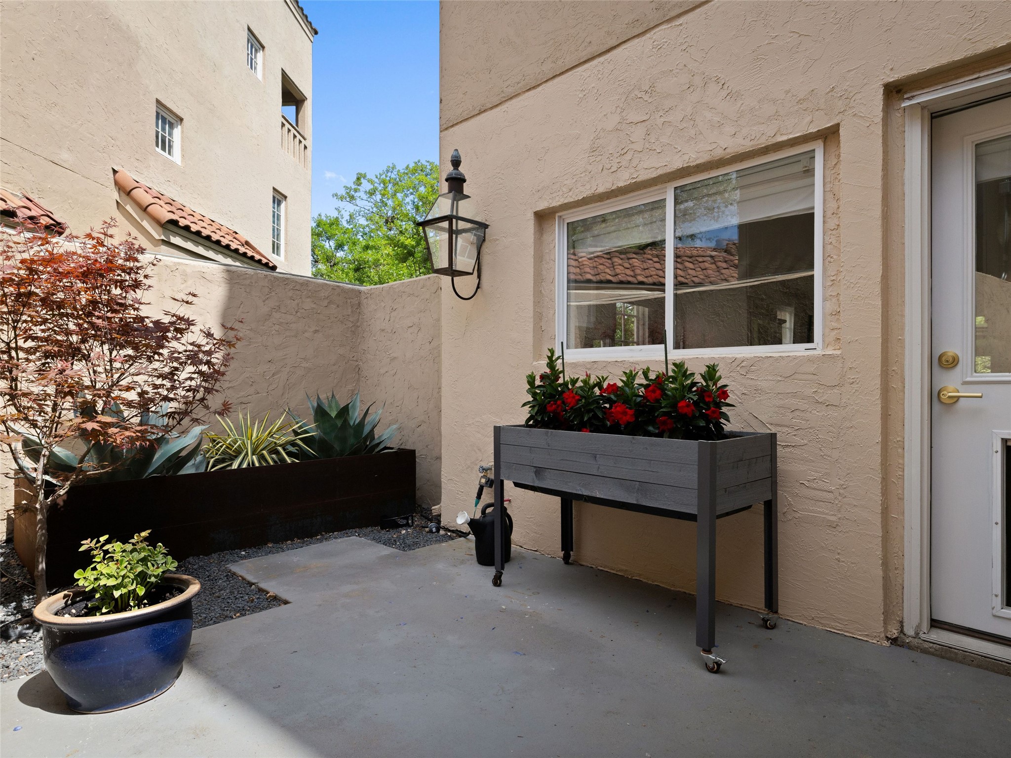 1937 Rue De St Tropez, Unit 10 Austin, TX 78746 - Photo 14 of 39 a wooden bench sitting in front of a building