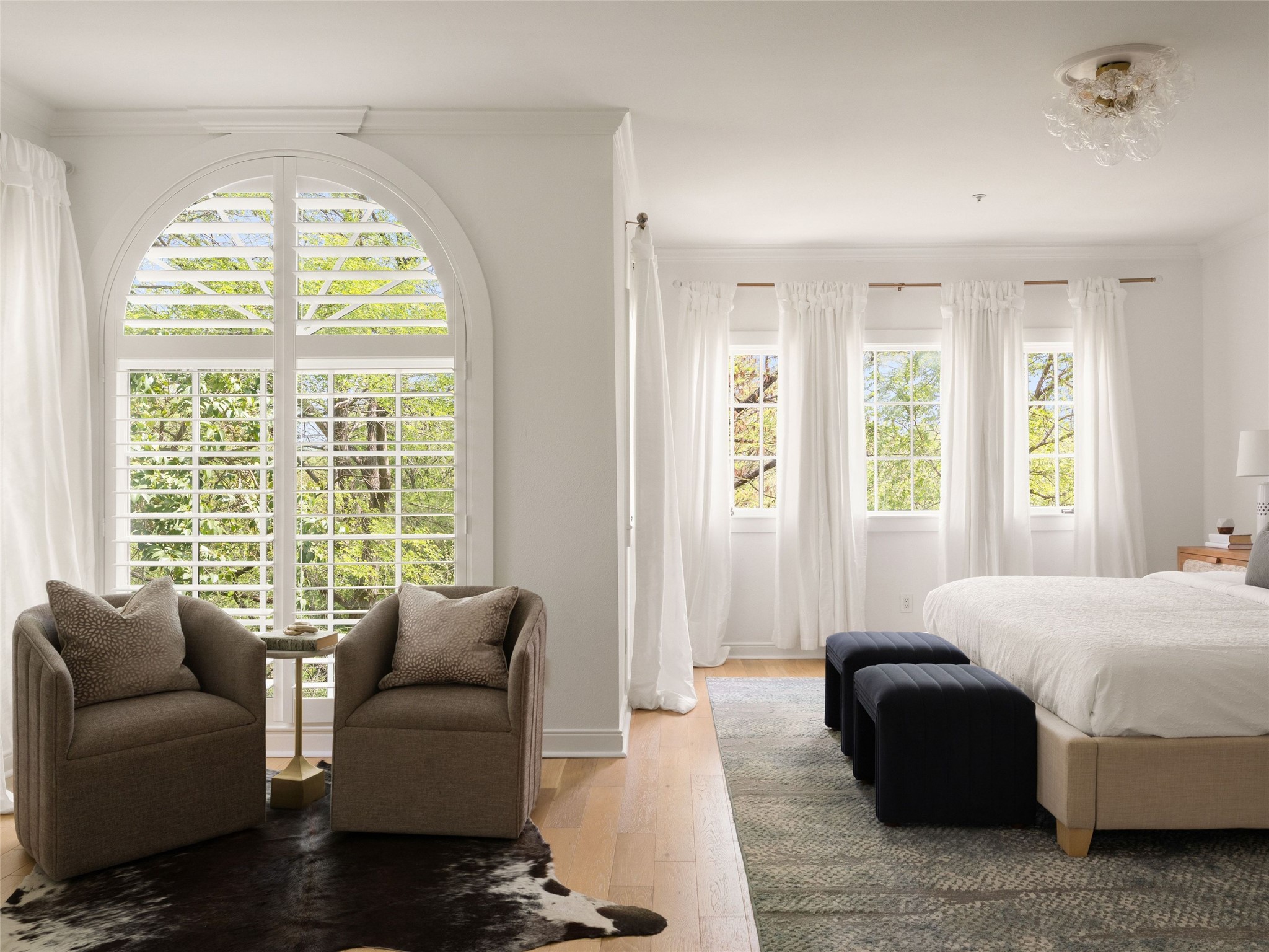 1937 Rue De St Tropez, Unit 10 Austin, TX 78746 - Photo 17 of 39 a bedroom with a bed and a couch