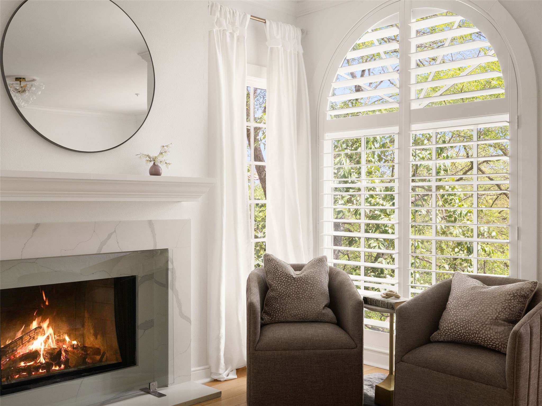 1937 Rue De St Tropez, Unit 10 Austin, TX 78746 - Photo 18 of 39 a living room with furniture and a fireplace