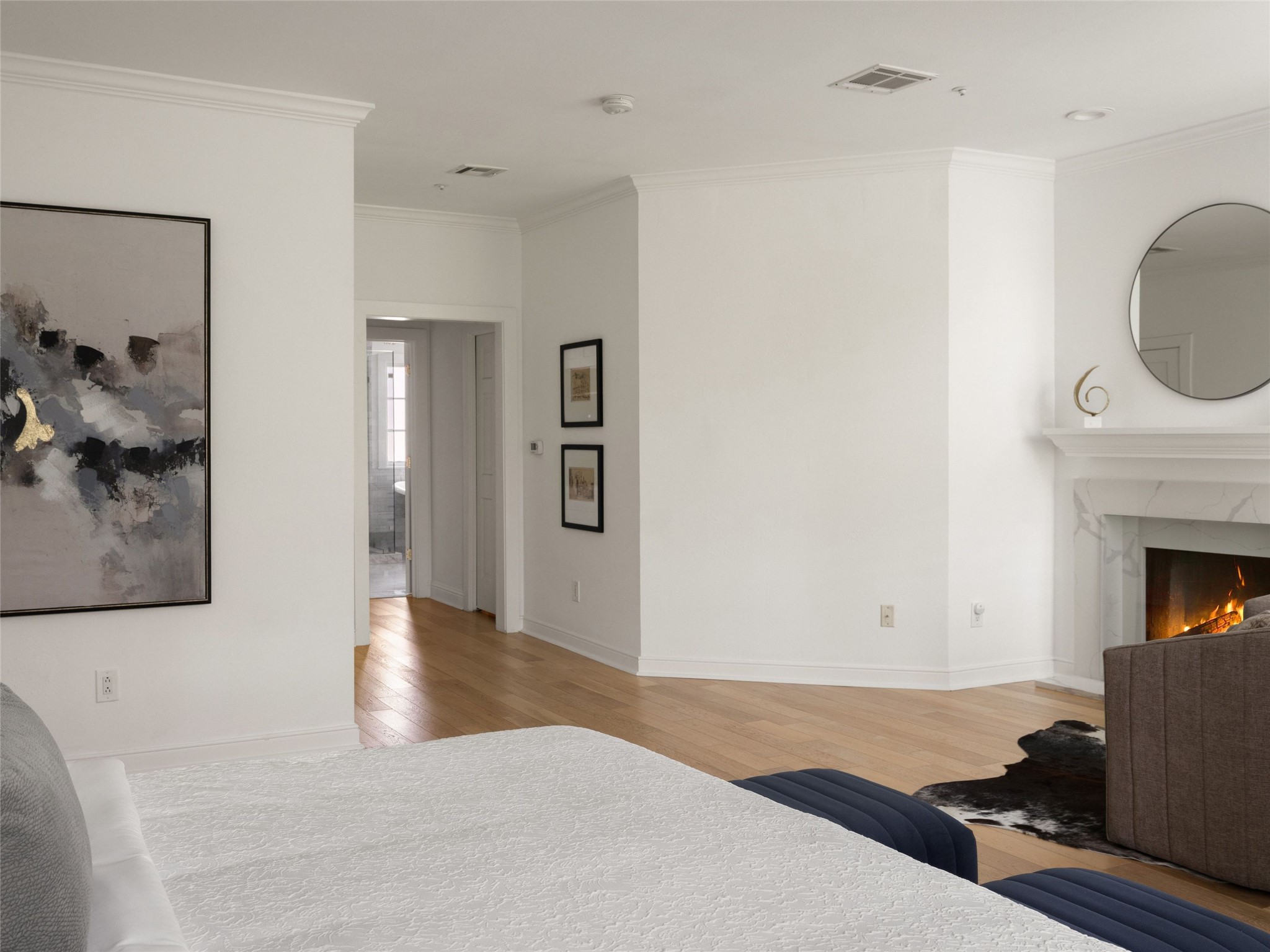 1937 Rue De St Tropez, Unit 10 Austin, TX 78746 - Photo 20 of 39 a view of a livingroom with wooden floor and a fireplace