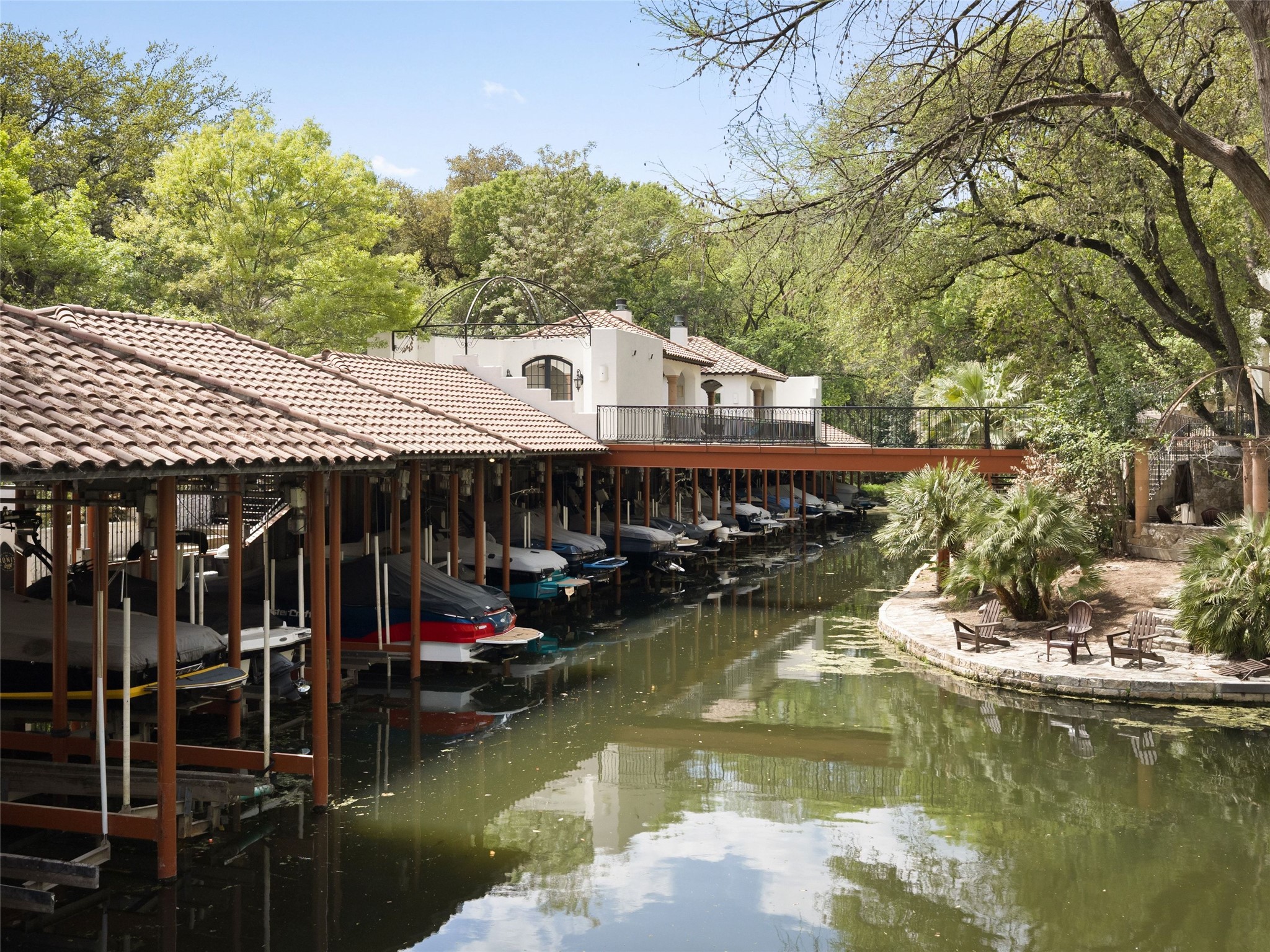 1937 Rue De St Tropez, Unit 10 Austin, TX 78746 - Photo 2 of 39 a view of a house with a lake view