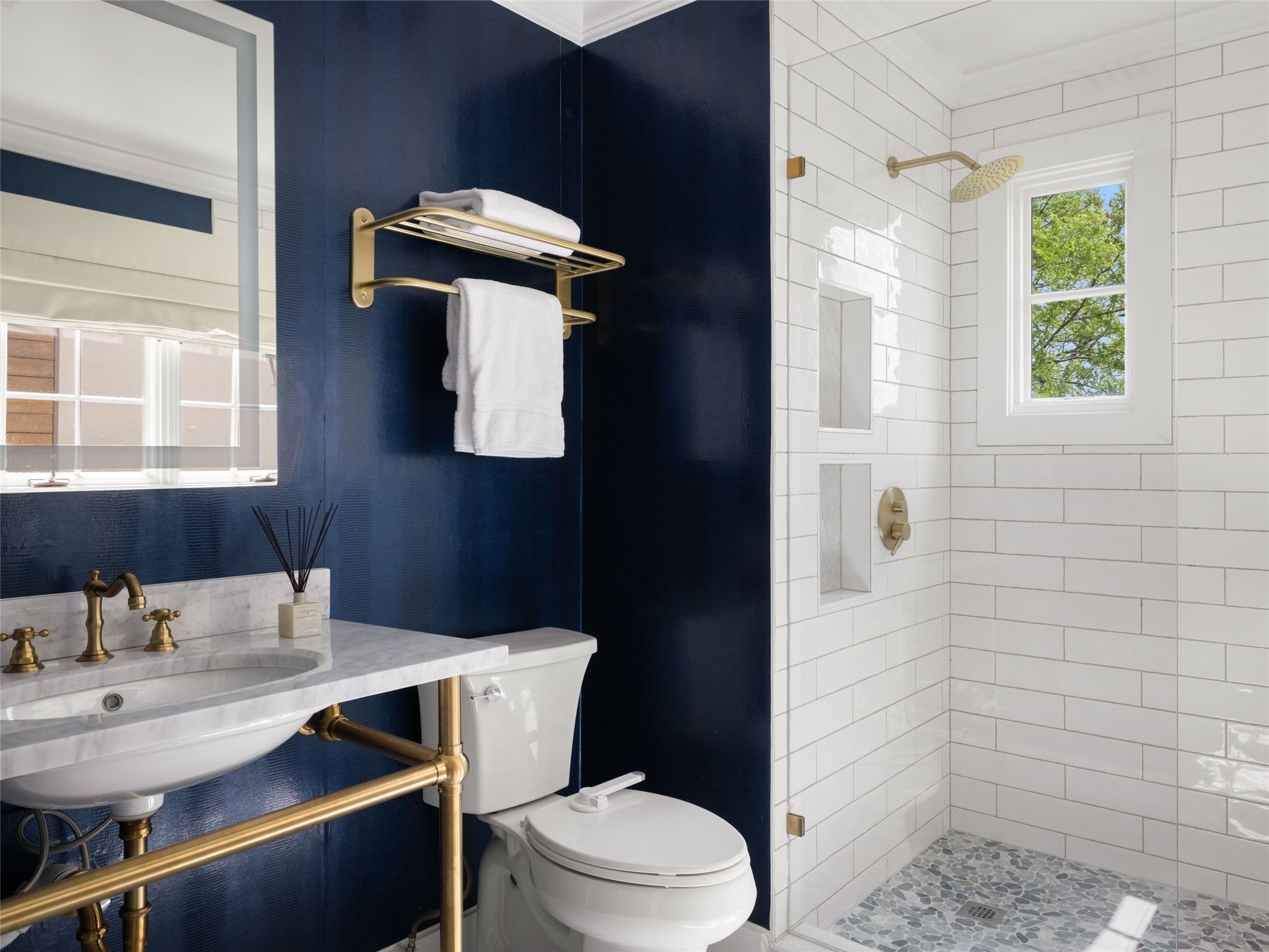 1937 Rue De St Tropez, Unit 10 Austin, TX 78746 - Photo 25 of 39 a bathroom with a toilet a sink and mirror