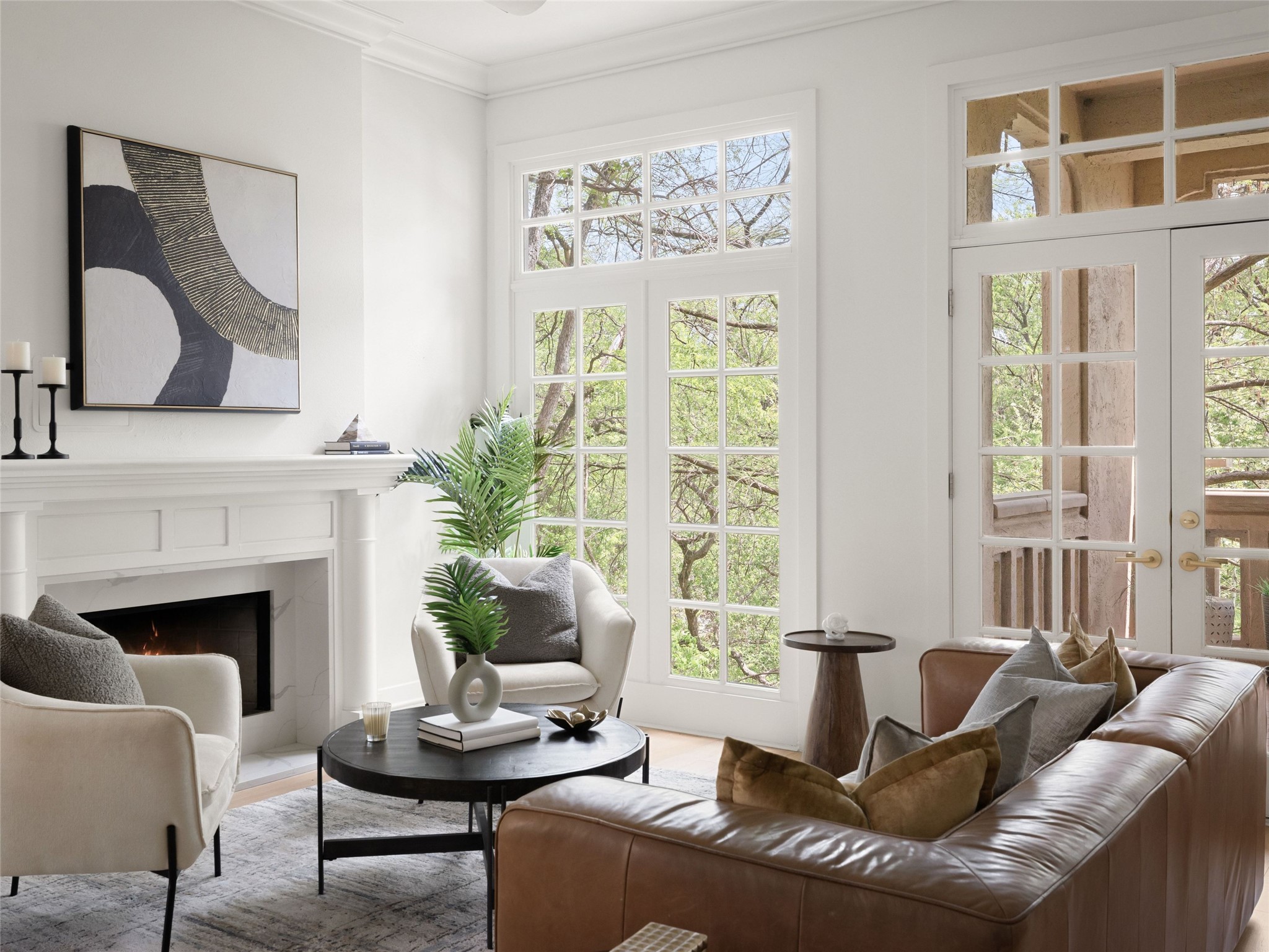1937 Rue De St Tropez, Unit 10 Austin, TX 78746 - Photo 3 of 39 a living room with furniture and a fireplace