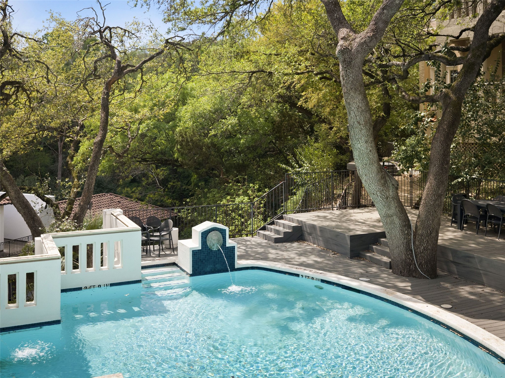 1937 Rue De St Tropez, Unit 10 Austin, TX 78746 - Photo 33 of 39 a view of a yard with plants and a trees