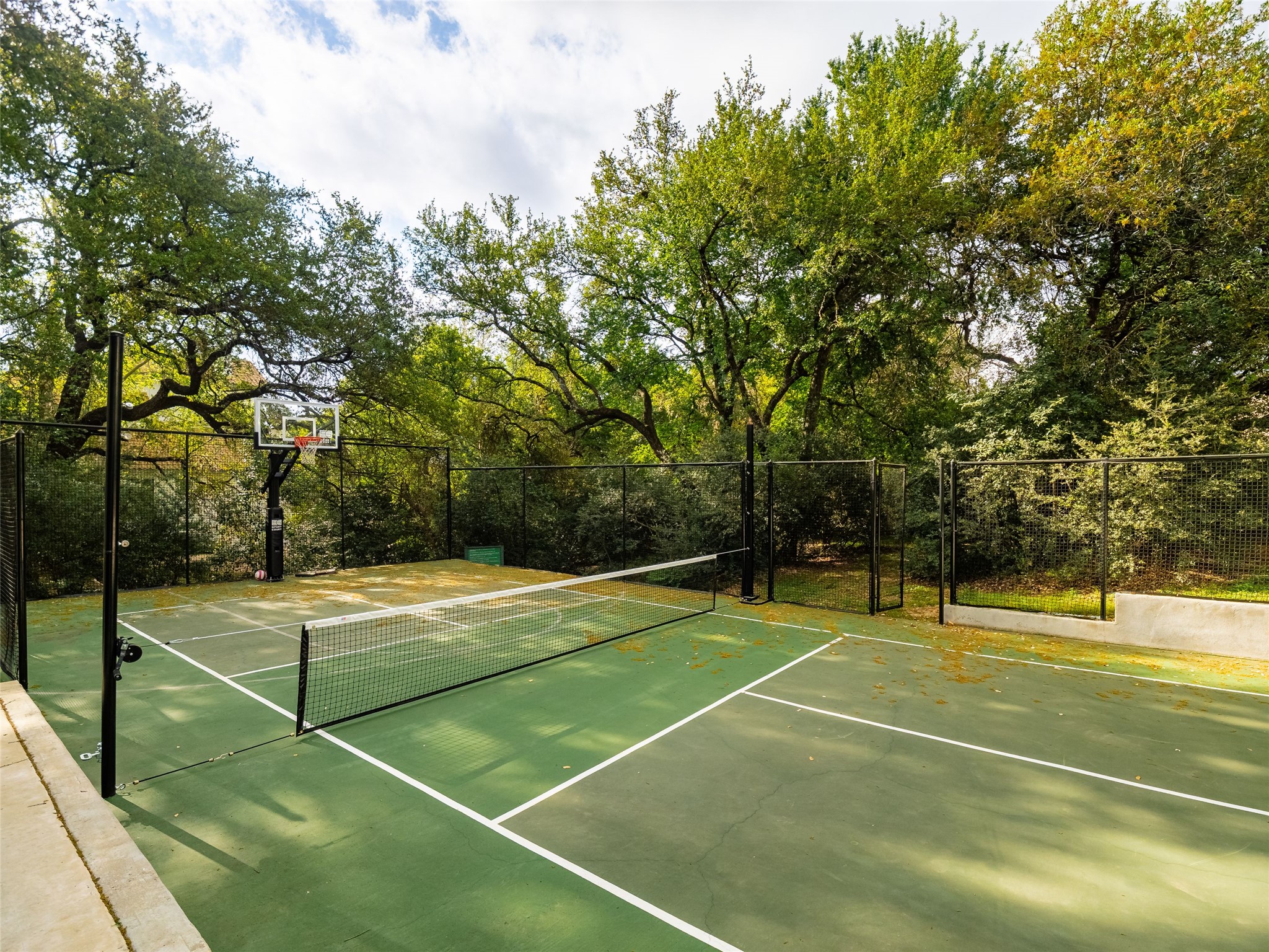 1937 Rue De St Tropez, Unit 10 Austin, TX 78746 - Photo 34 of 39 a view of a tennis court