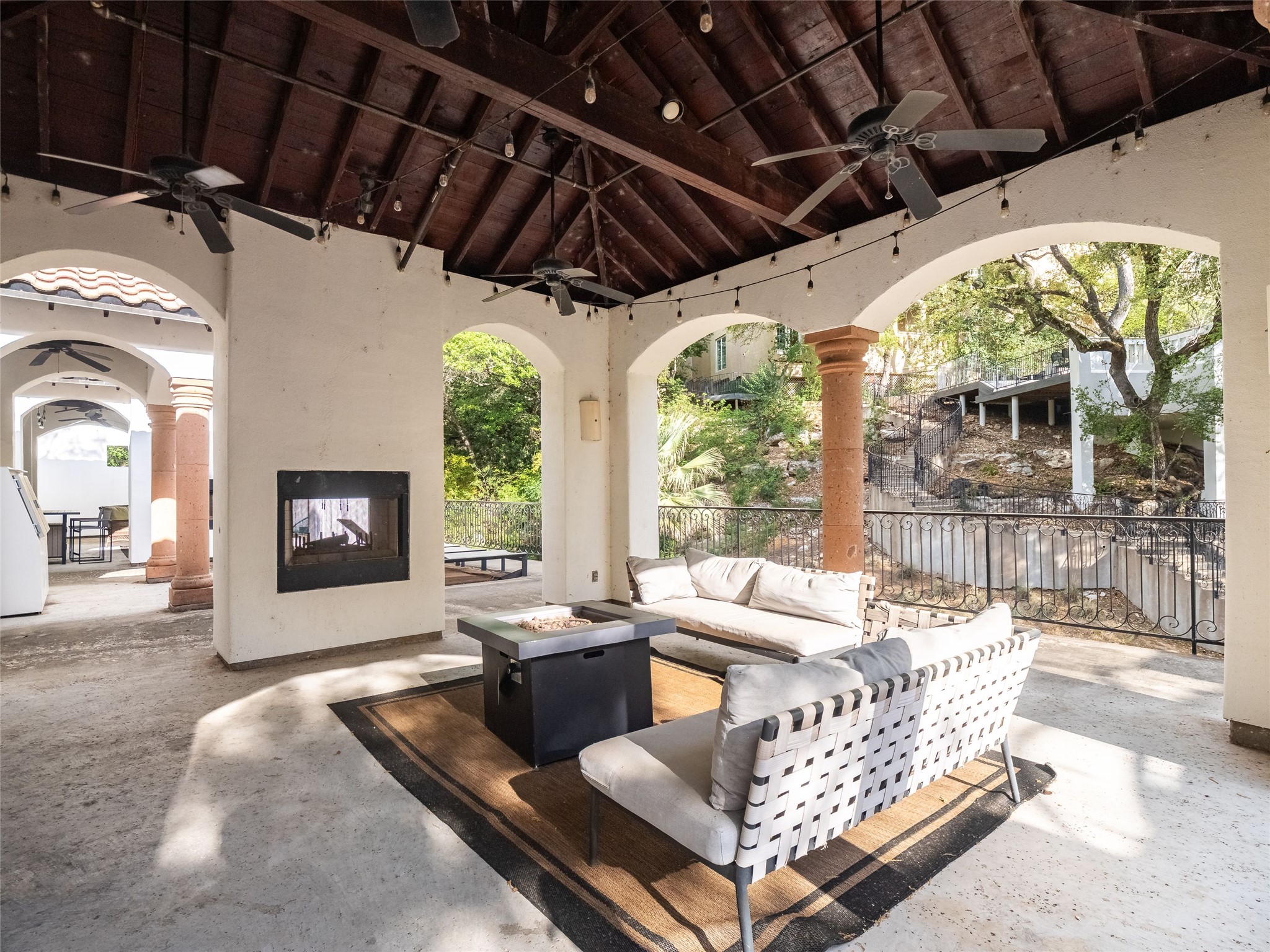 1937 Rue De St Tropez, Unit 10 Austin, TX 78746 - Photo 35 of 39 a living room with furniture and a large window