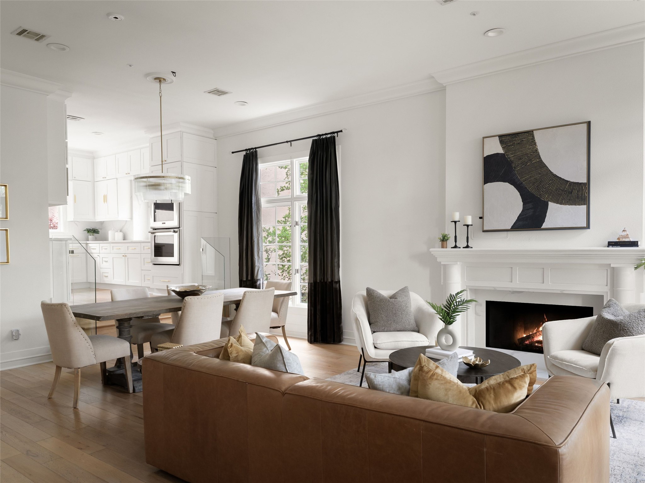 1937 Rue De St Tropez, Unit 10 Austin, TX 78746 - Photo 6 of 39 a living room with furniture and a fireplace