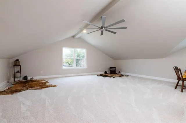 a view of a livingroom with a stove and a window