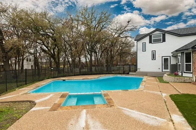 a view of swimming pool with lounge chair