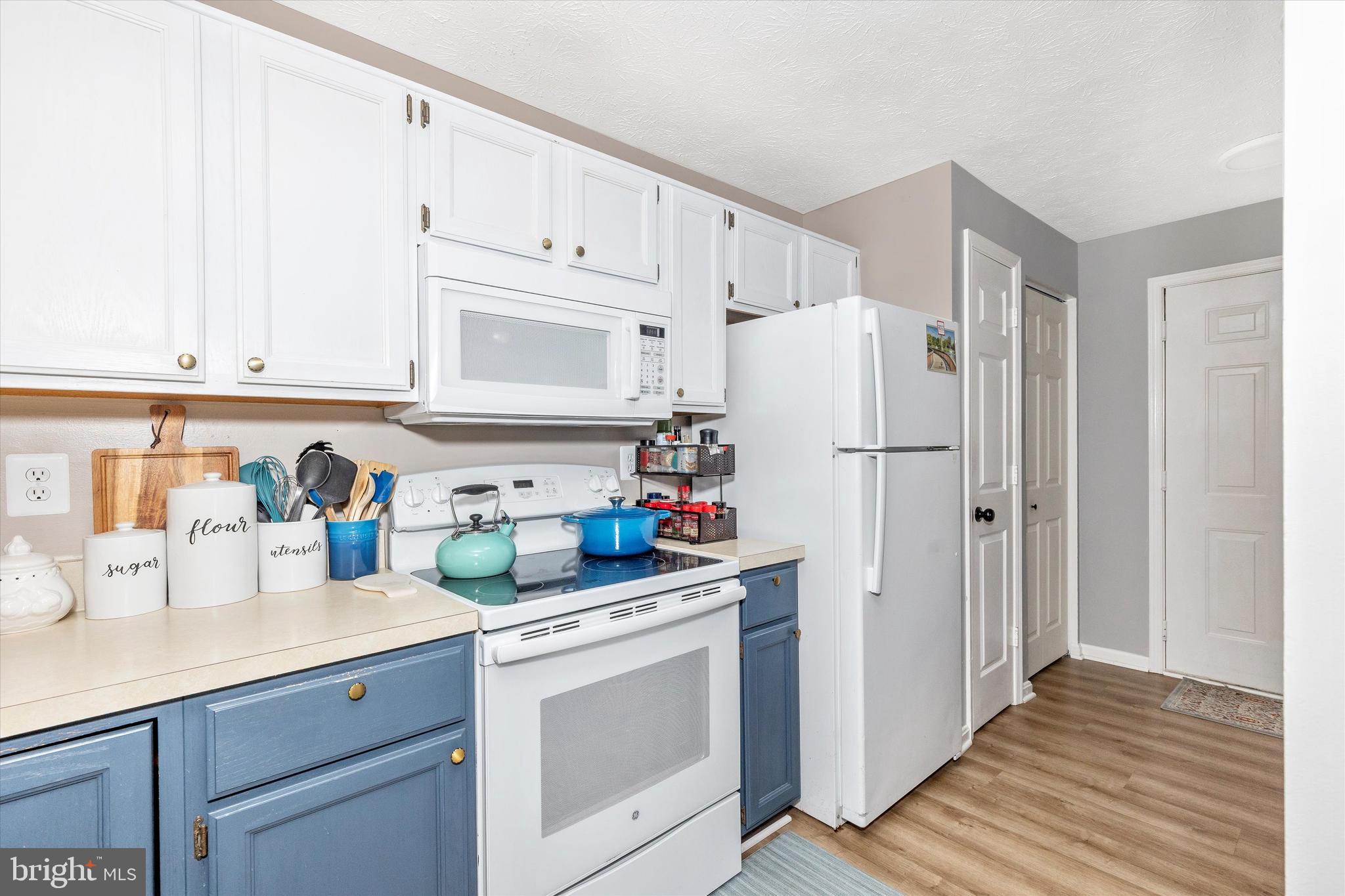 2102 Whitehall Road, Unit BC Frederick, MD 21702 - Photo 11 of 29 a kitchen with refrigerator a stove a sink and cabinets