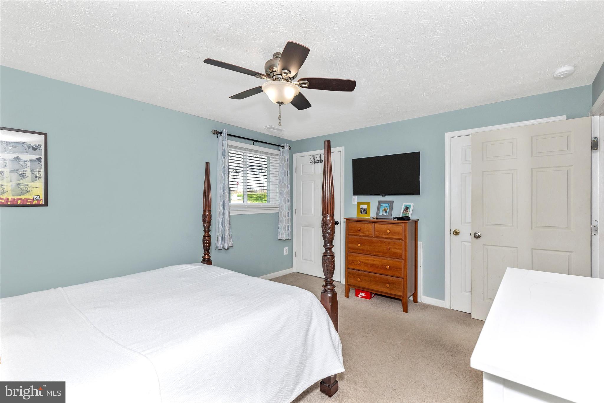 2102 Whitehall Road, Unit BC Frederick, MD 21702 - Photo 15 of 29 a bedroom with a bed and a flat screen tv