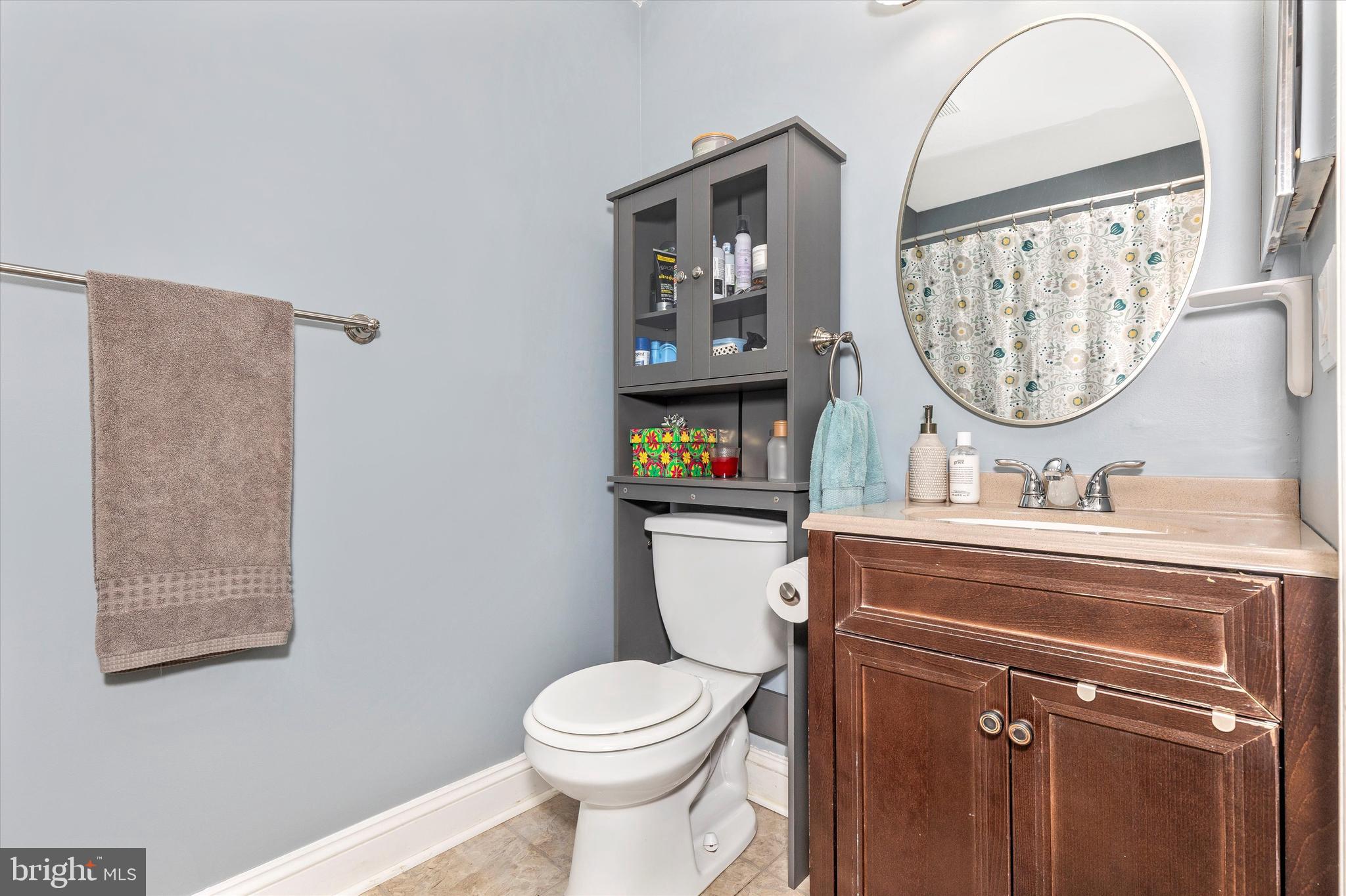 2102 Whitehall Road, Unit BC Frederick, MD 21702 - Photo 16 of 29 a bathroom with a toilet a sink and a mirror