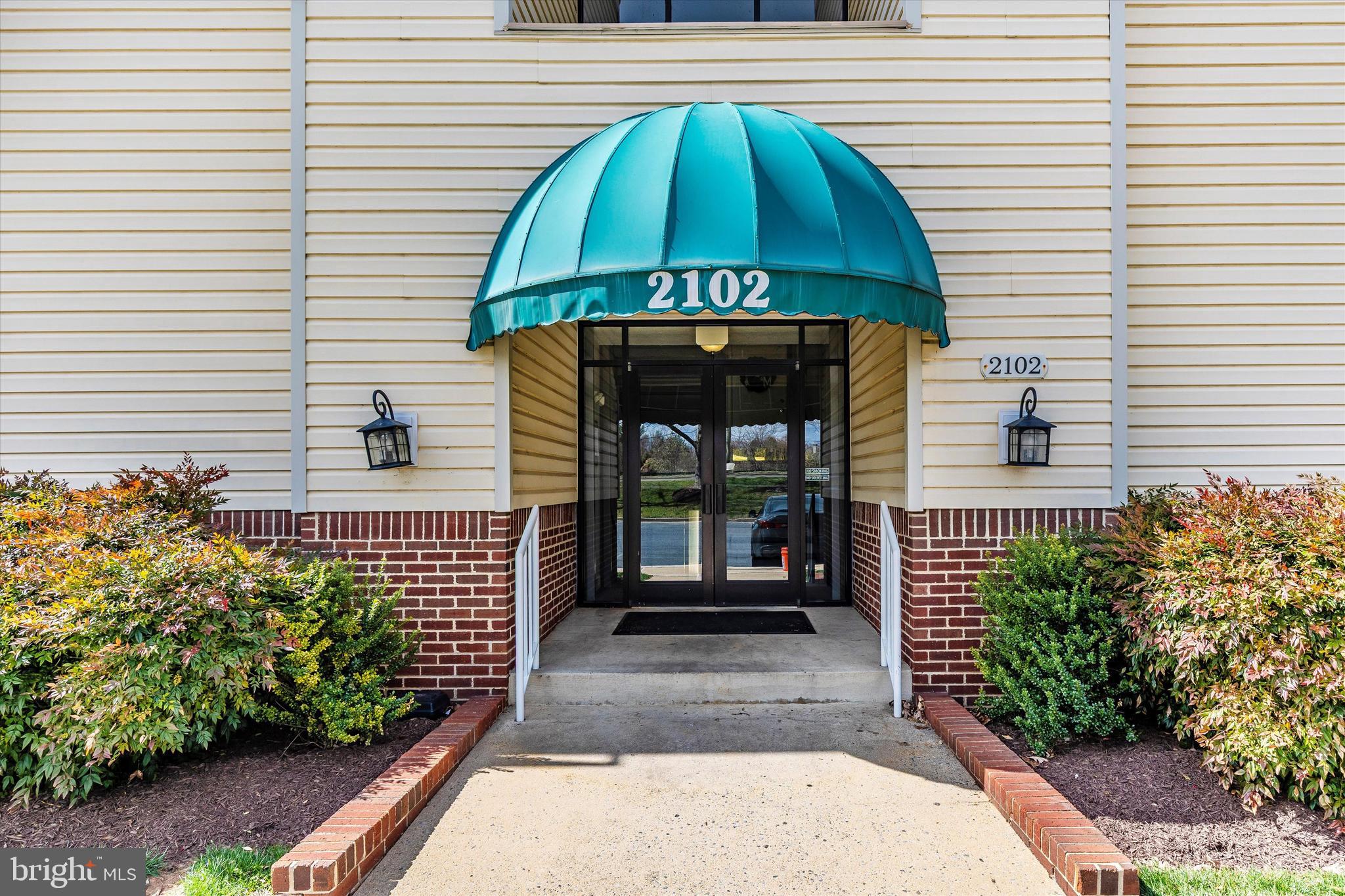 2102 Whitehall Road, Unit BC Frederick, MD 21702 - Photo 2 of 29 a front view of a house with garden