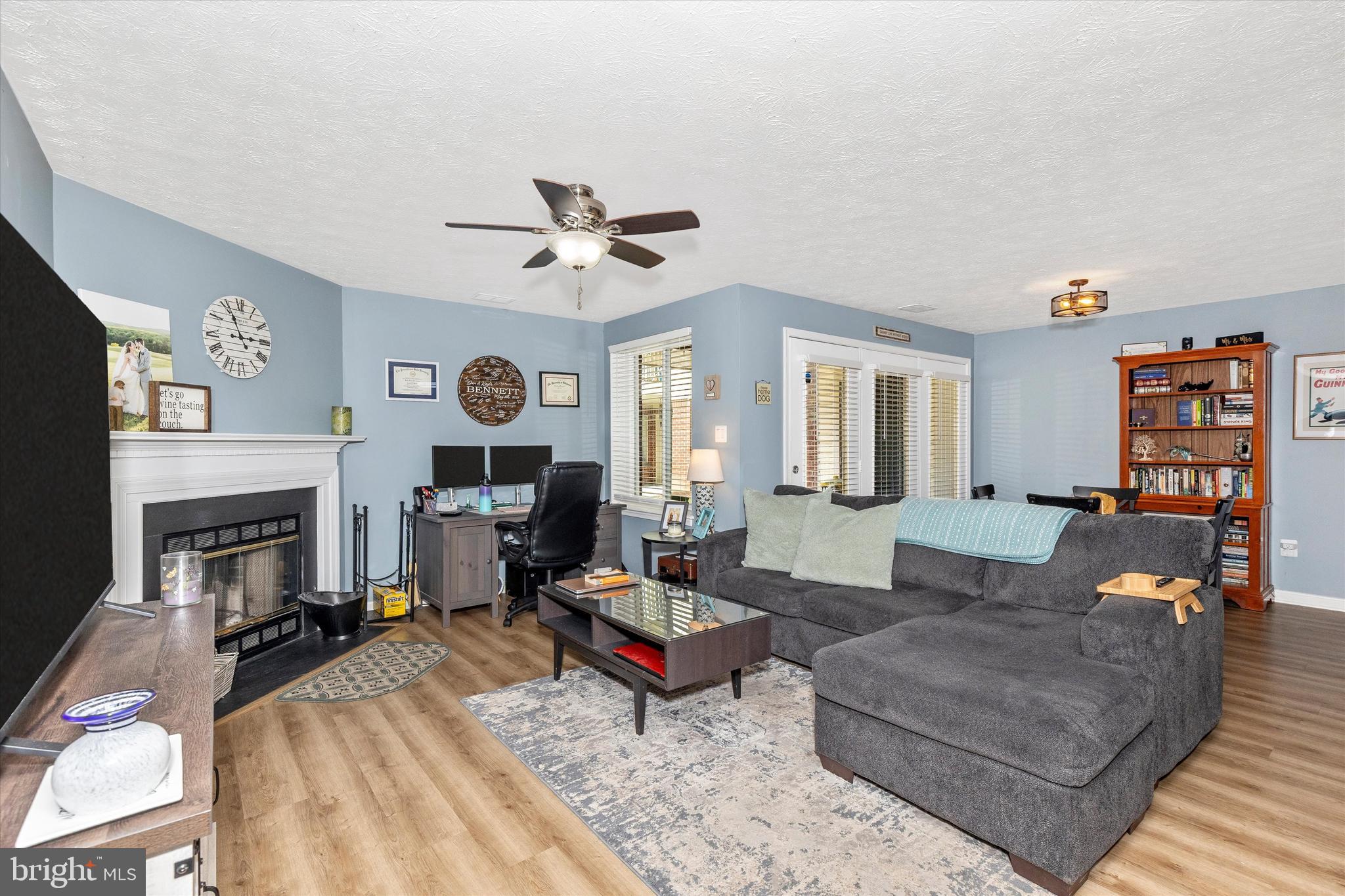 2102 Whitehall Road, Unit BC Frederick, MD 21702 - Photo 6 of 29 a living room with furniture a fireplace and a flat screen tv