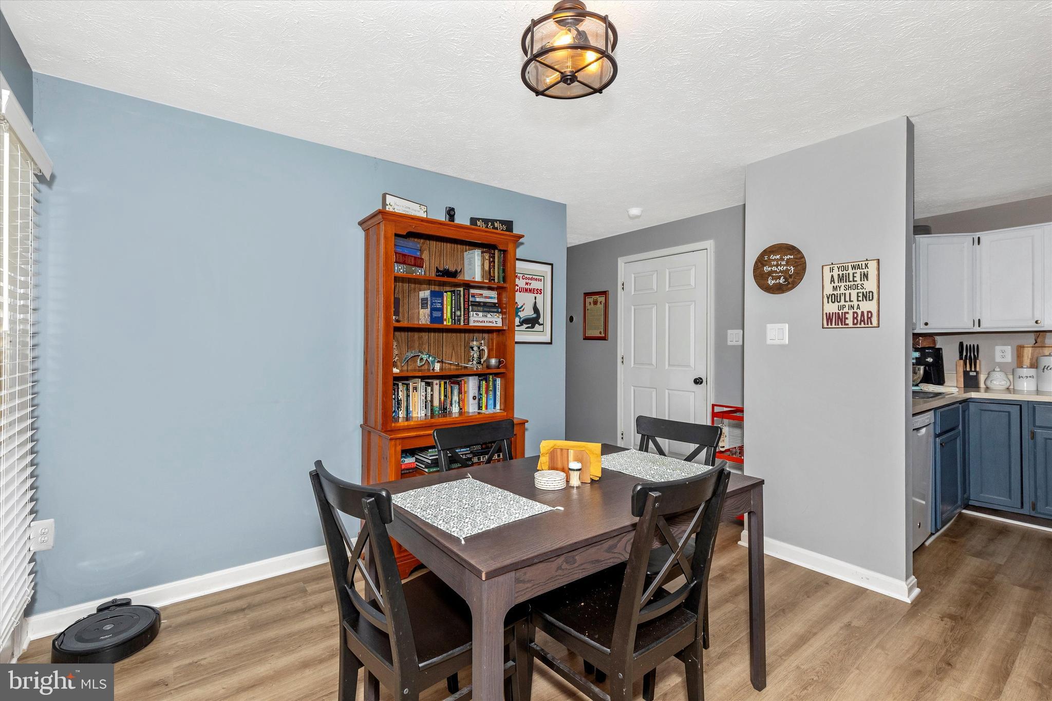 2102 Whitehall Road, Unit BC Frederick, MD 21702 - Photo 9 of 29 a view of a dining room with furniture and wooden floor