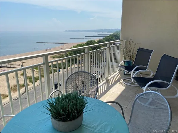 a view of balcony with furniture and wooden floor