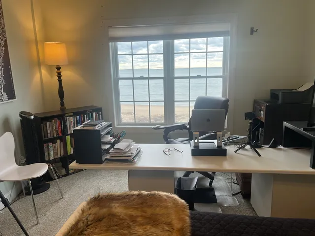 a workspace with furniture and lamp