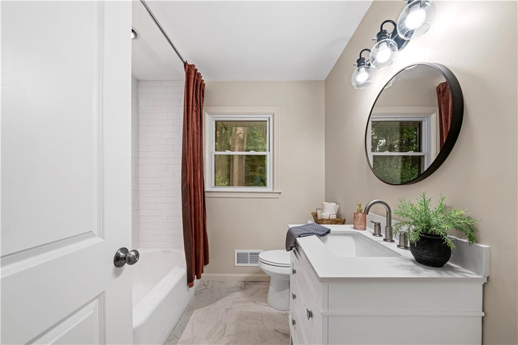 23 East Camelia Road Northeast Rome, GA 30161 - Photo 12 of 27 a bathroom with a sink and a mirror
