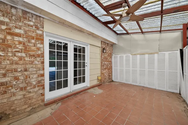 a view of empty room with windows