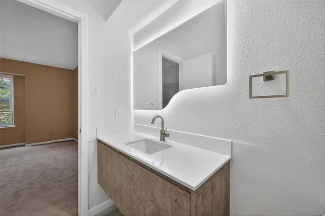 a white sink sitting in a bathroom