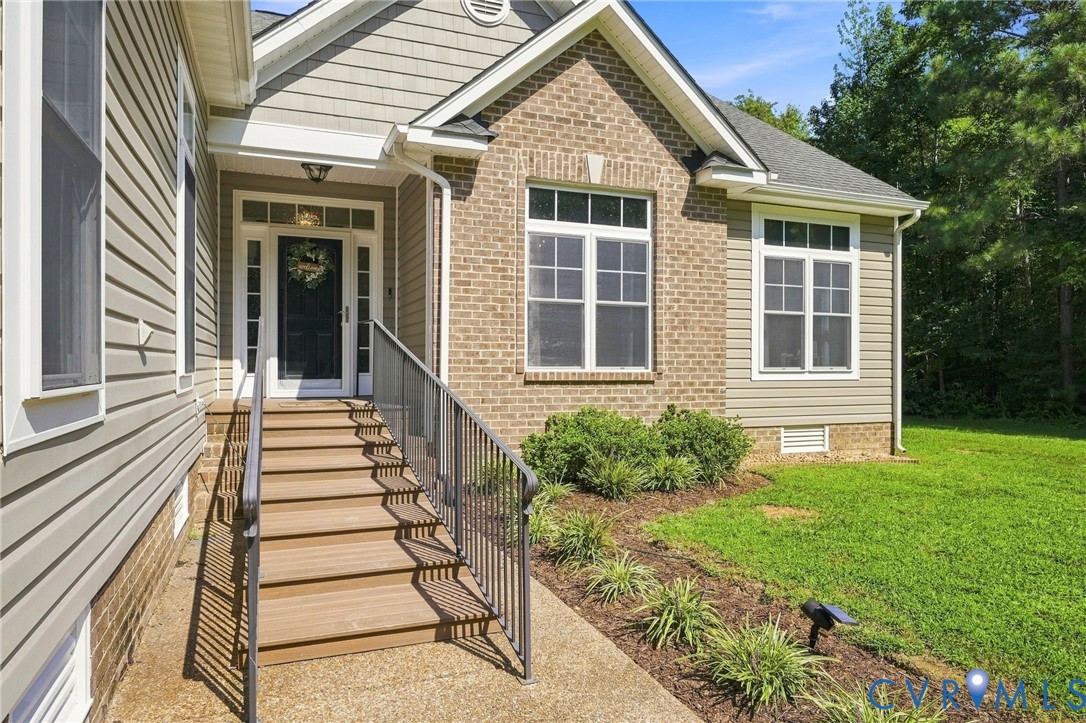 Brick and siding exterior with a covered entry and