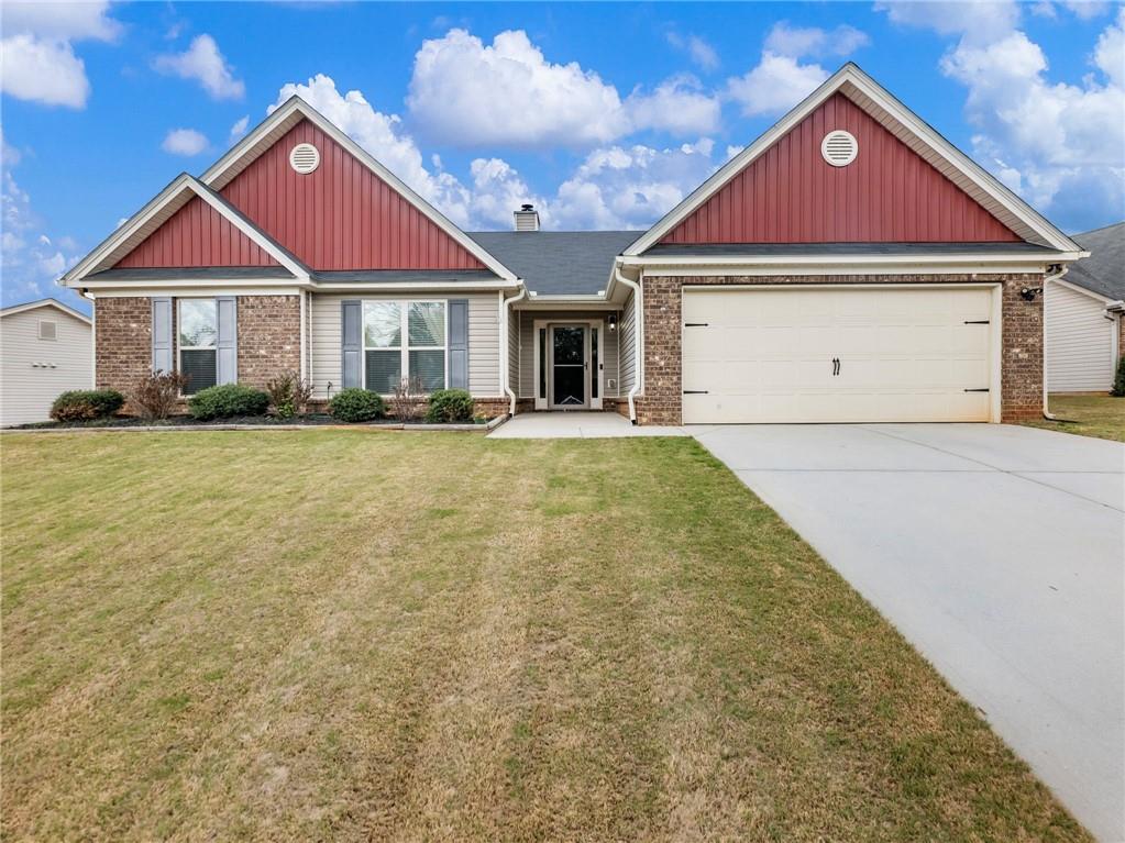 a front view of a house with yard