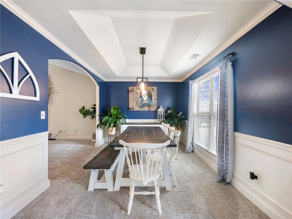 476 River Mist Circle Jefferson, GA 30549 - Photo 12 of 44 a view of a dining room with furniture and a chandelier