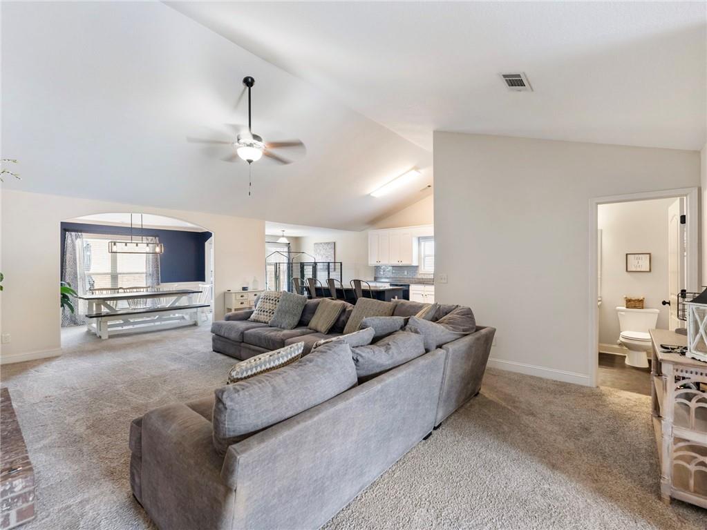 476 River Mist Circle Jefferson, GA 30549 - Photo 16 of 44 a living room with furniture and a flat screen tv