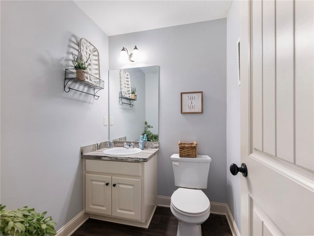 476 River Mist Circle Jefferson, GA 30549 - Photo 17 of 44 a bathroom with a toilet a sink and mirror