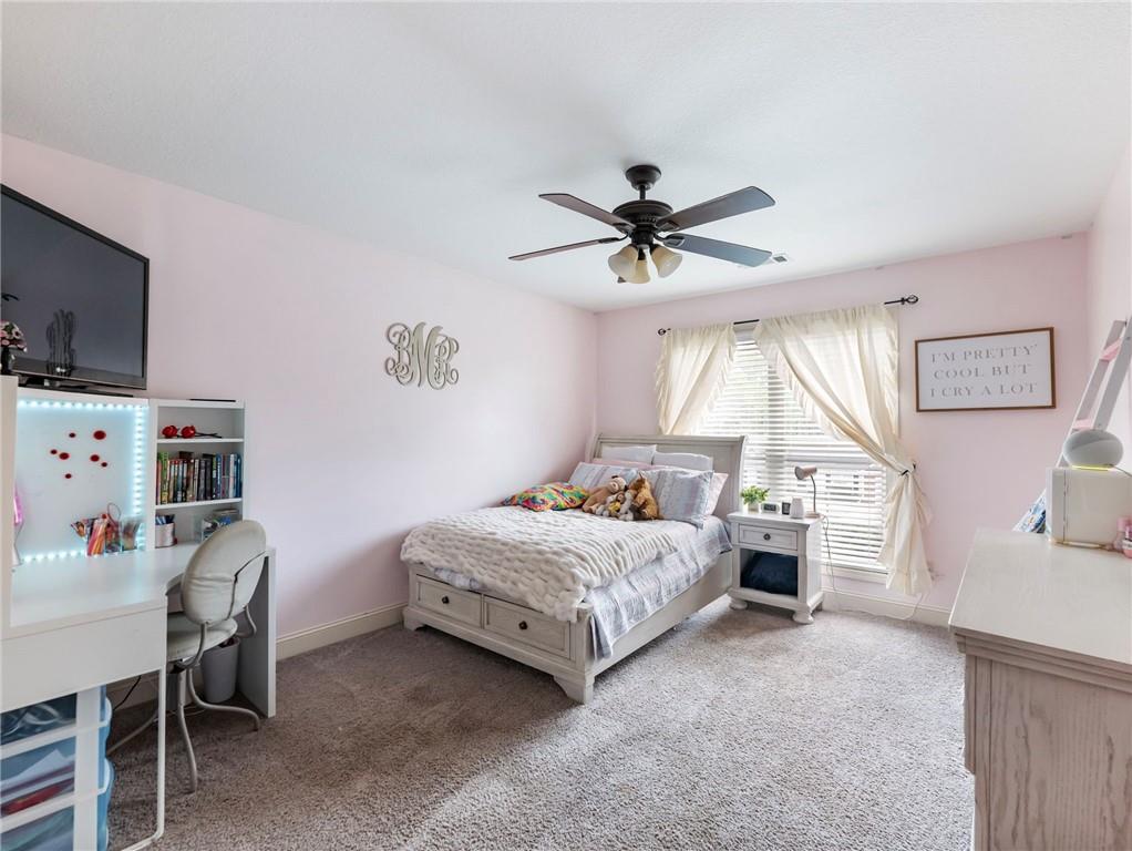 476 River Mist Circle Jefferson, GA 30549 - Photo 18 of 44 a bedroom with a bed a desk and chair