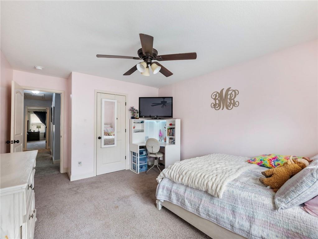 476 River Mist Circle Jefferson, GA 30549 - Photo 19 of 44 a bedroom with a bed and a television