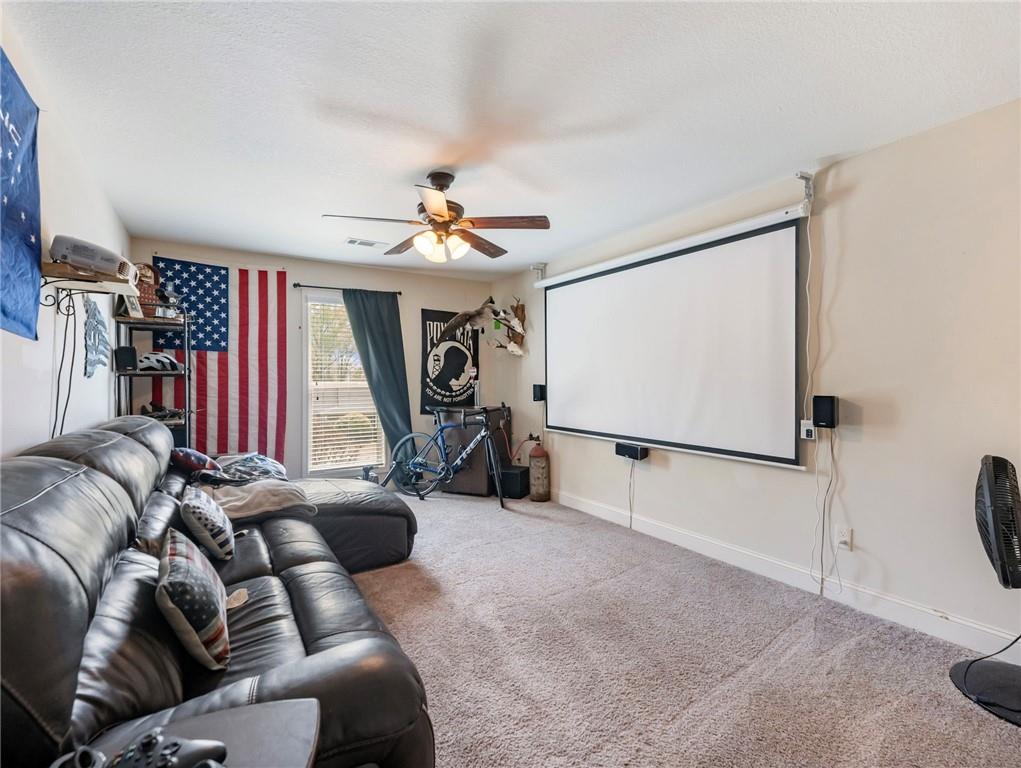 476 River Mist Circle Jefferson, GA 30549 - Photo 20 of 44 a living room with furniture a ceiling fan and a rug