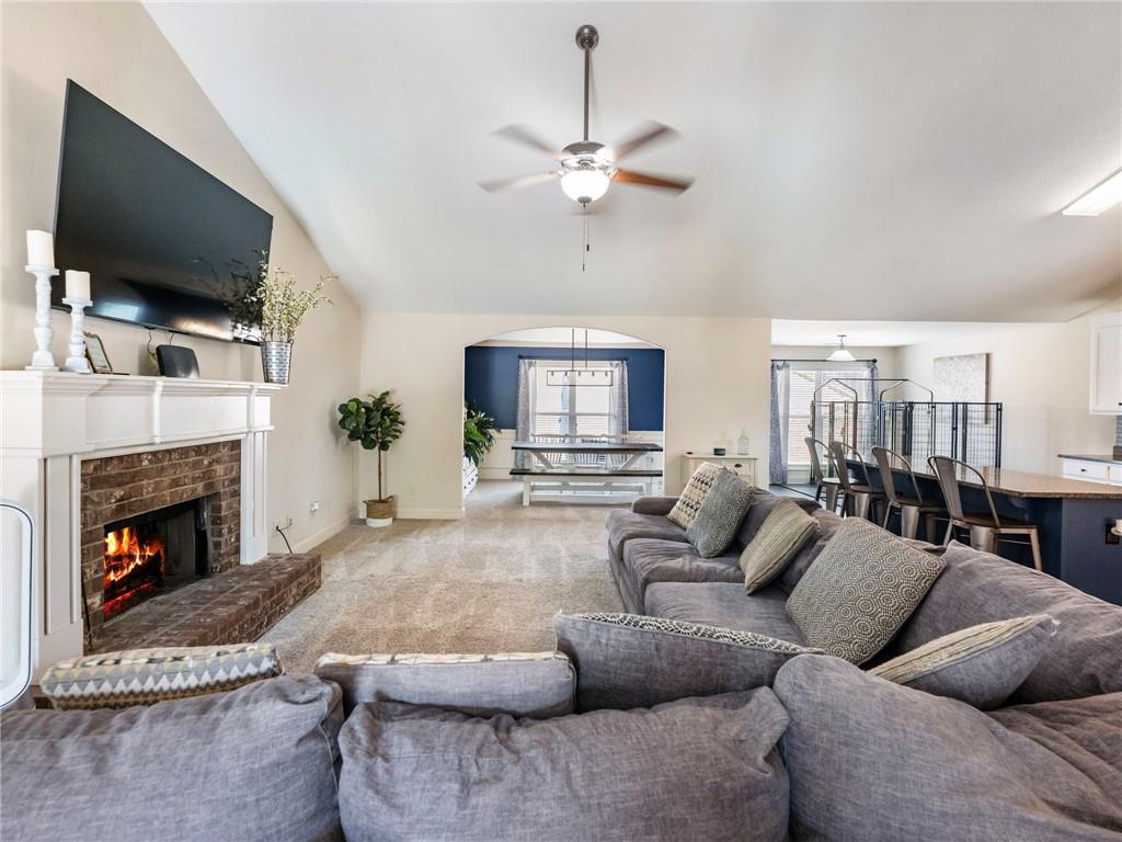 476 River Mist Circle Jefferson, GA 30549 - Photo 3 of 44 a living room with furniture a fireplace and a flat screen tv
