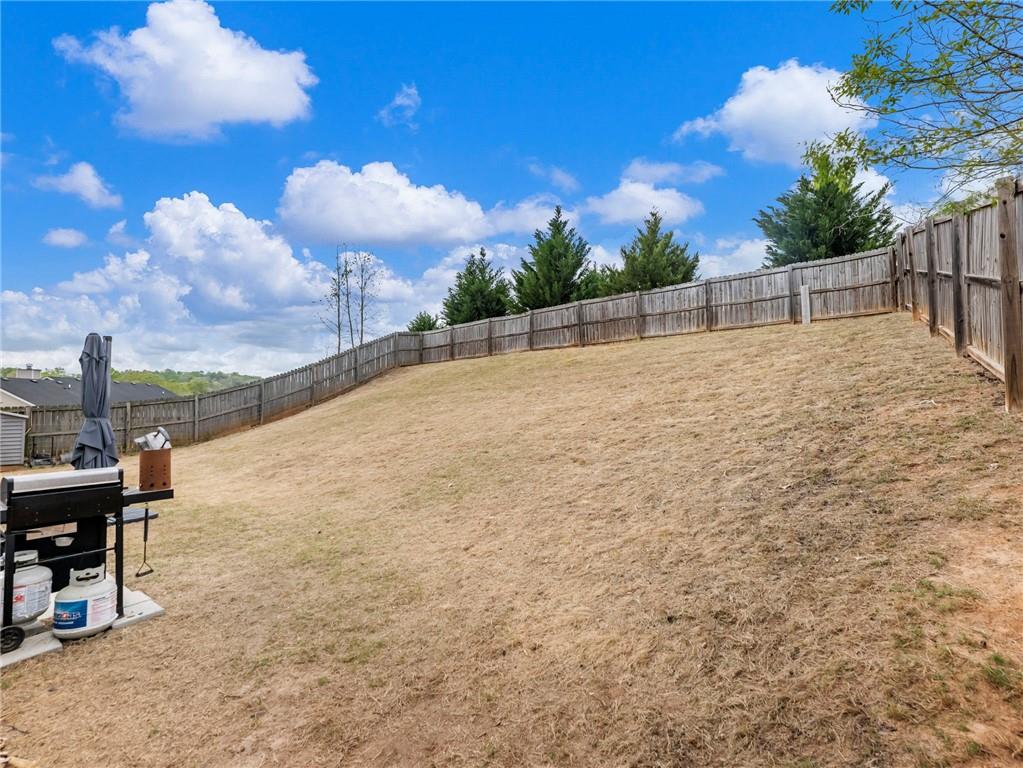 476 River Mist Circle Jefferson, GA 30549 - Photo 35 of 44 a backyard of a house with table and chairs